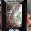 zippo chạm khắc cá chép hóa rồng mầu bạc
